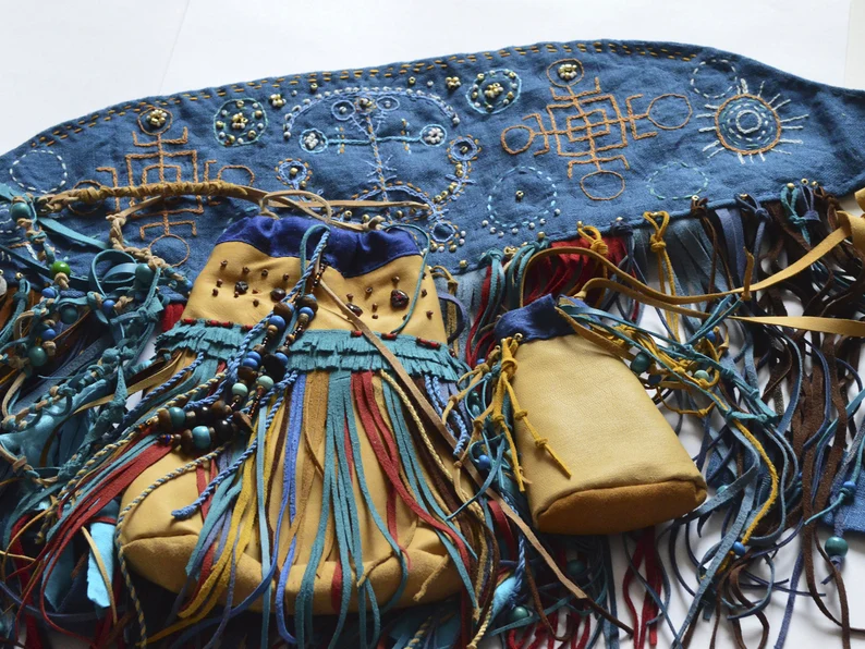 Small shamanistic set: shaman pagan mask with embroidered and medicine bags. Shamanic tools for ceremony.